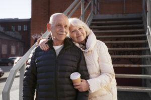 Home - medium shot senior people with coffee cup