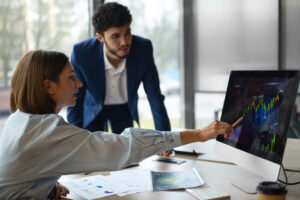 Home - people office analyzing checking finance graphs scaled