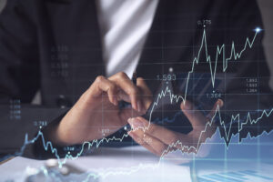 Home - woman financial trader formal wear is checking phone sign contract invest money stock market internet trading wealth management concept forex hologram chart scaled