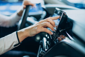 Home - woman touching screen her car scaled